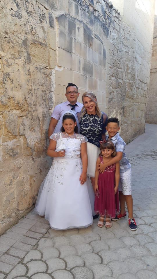 Therese with her three children and her husband.
