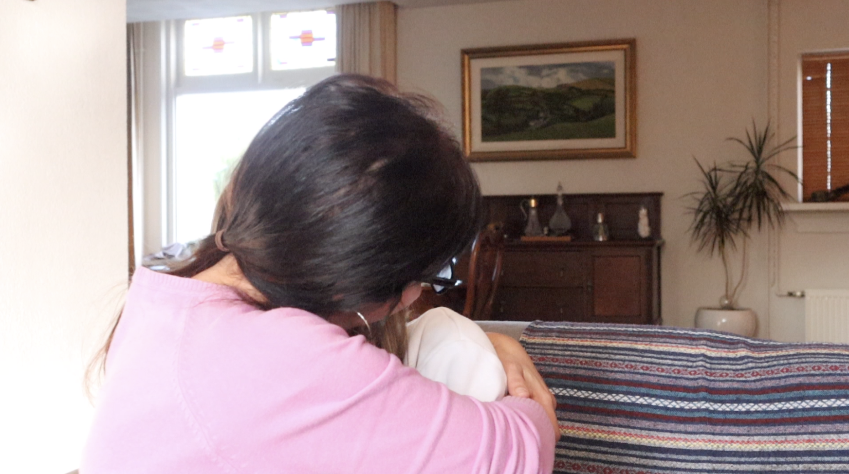 Maria Azzopardi crying in Heidi Farrugia's arms during our interview.