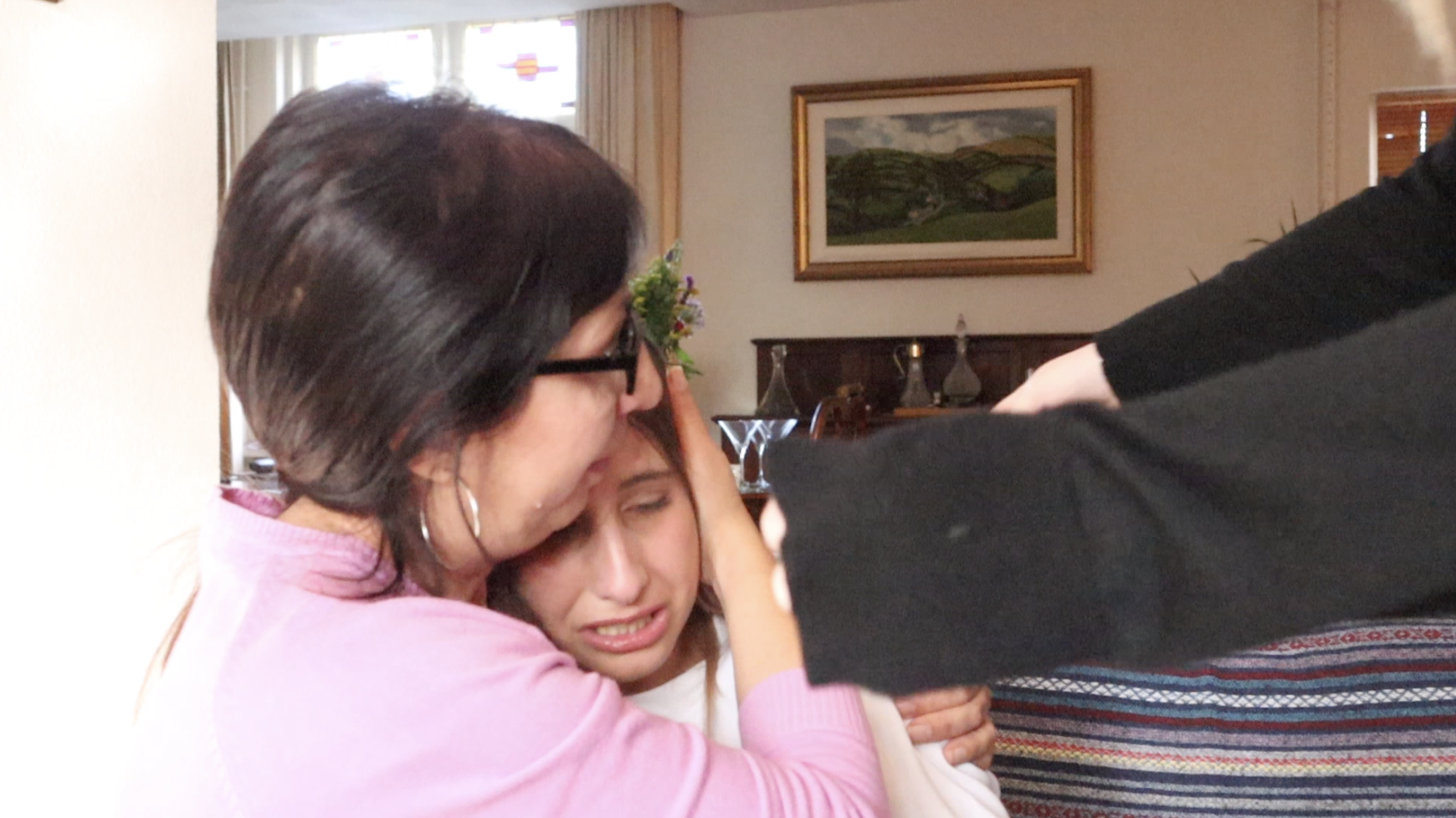 Maria Azzopardi crying in Heidi Farrugia's arms during our interview.